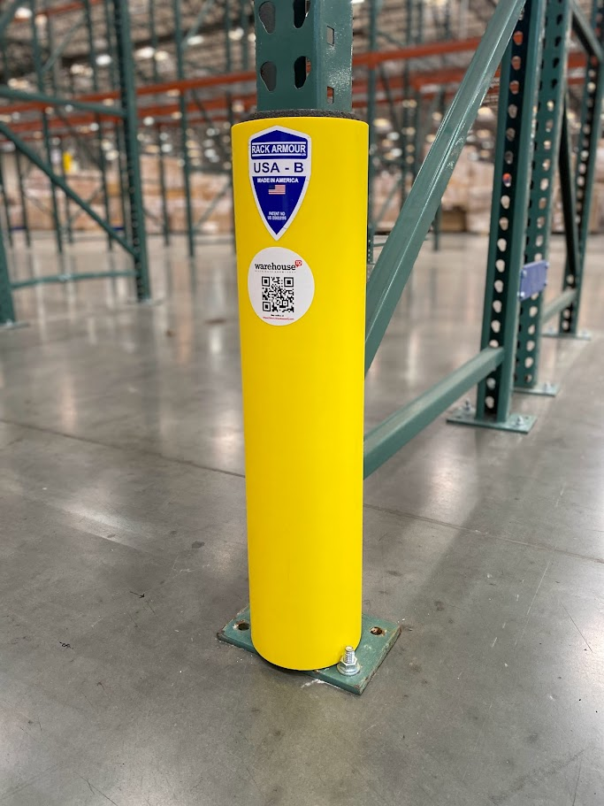 a yellow rack protector in the middle of a Inland Empire warehouse protecting pallet racking